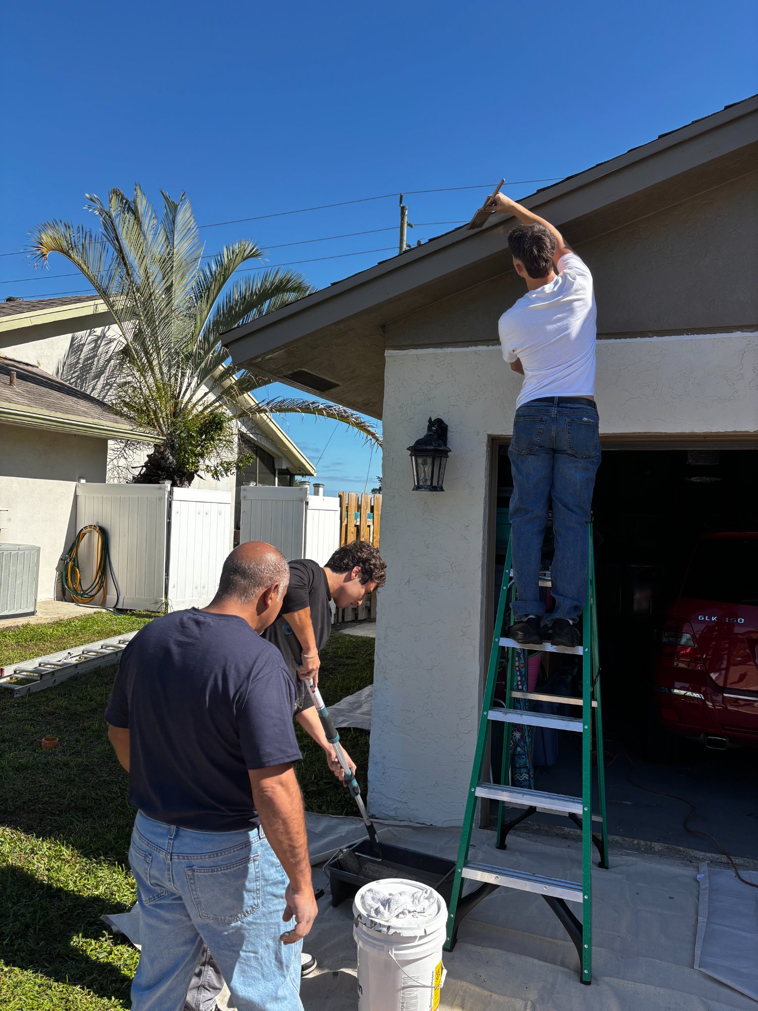 Team painting exterior together